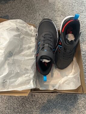 New Balance Kids Black Sneakers with Blue and Red Accents